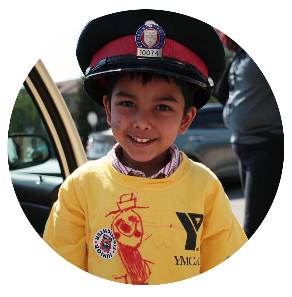 Child wearing a police officer's hat