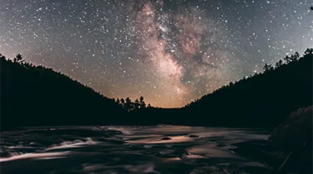 The magic of a YMCA Pine Crest wilderness whitewater canoe trip: Evening stars reflected over the Colonge River in Quebec.