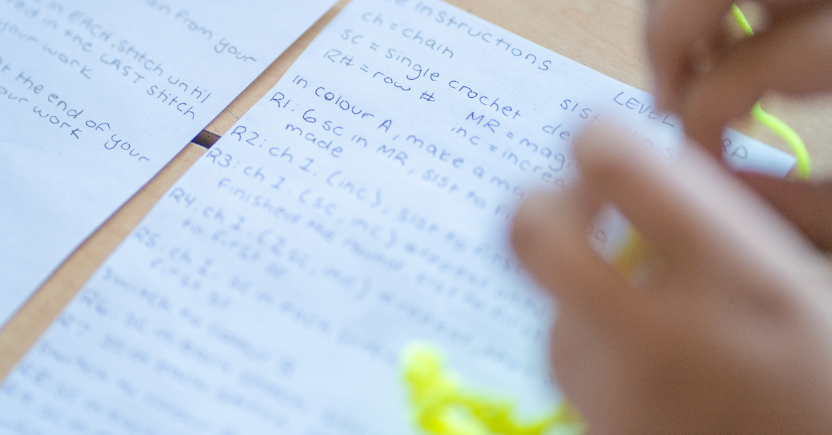 Handwritten notes from a Y M C A child care educator outline steps to start a crochet project.