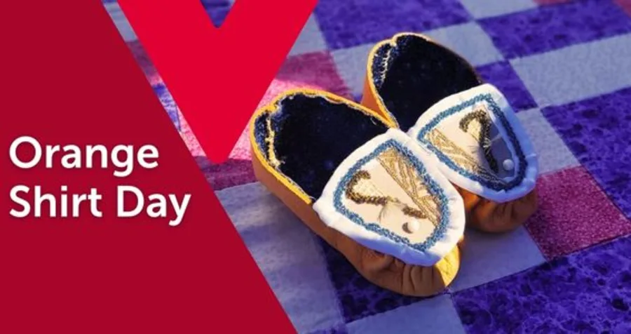 Text: Orange Shirt Day. Image: A pair of small, embroidered moccasins on a patchwork quilt.