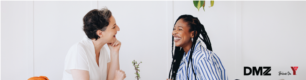 two women talking and smiling