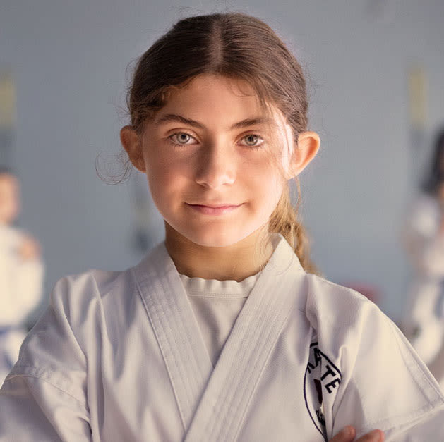 Young girl in Karate kimono