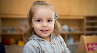 A happy pre-school girl at a YMCA child care centre