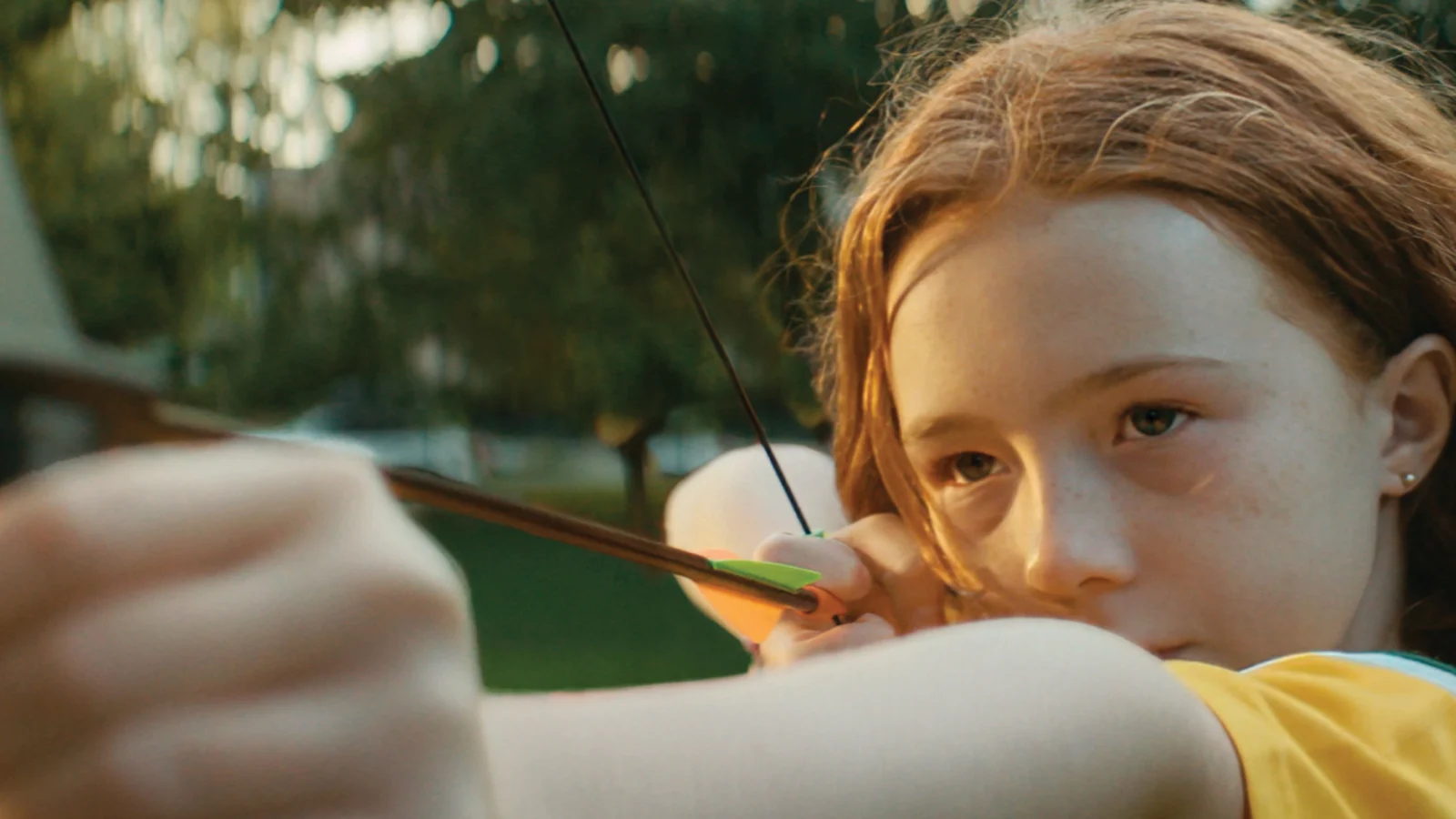 Girl aiming an arrow