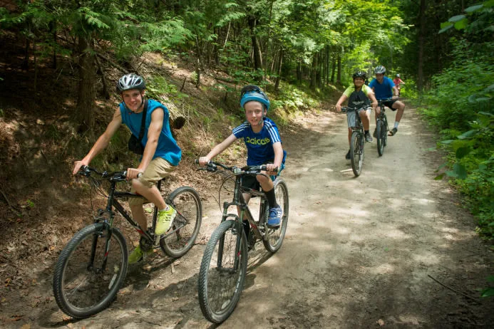 a group of youth biking