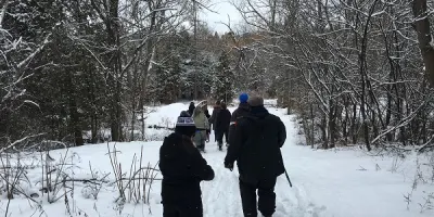 a group hiking in the winter snow