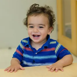 a toddler smiling