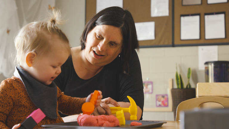 YMCA staff with Infant