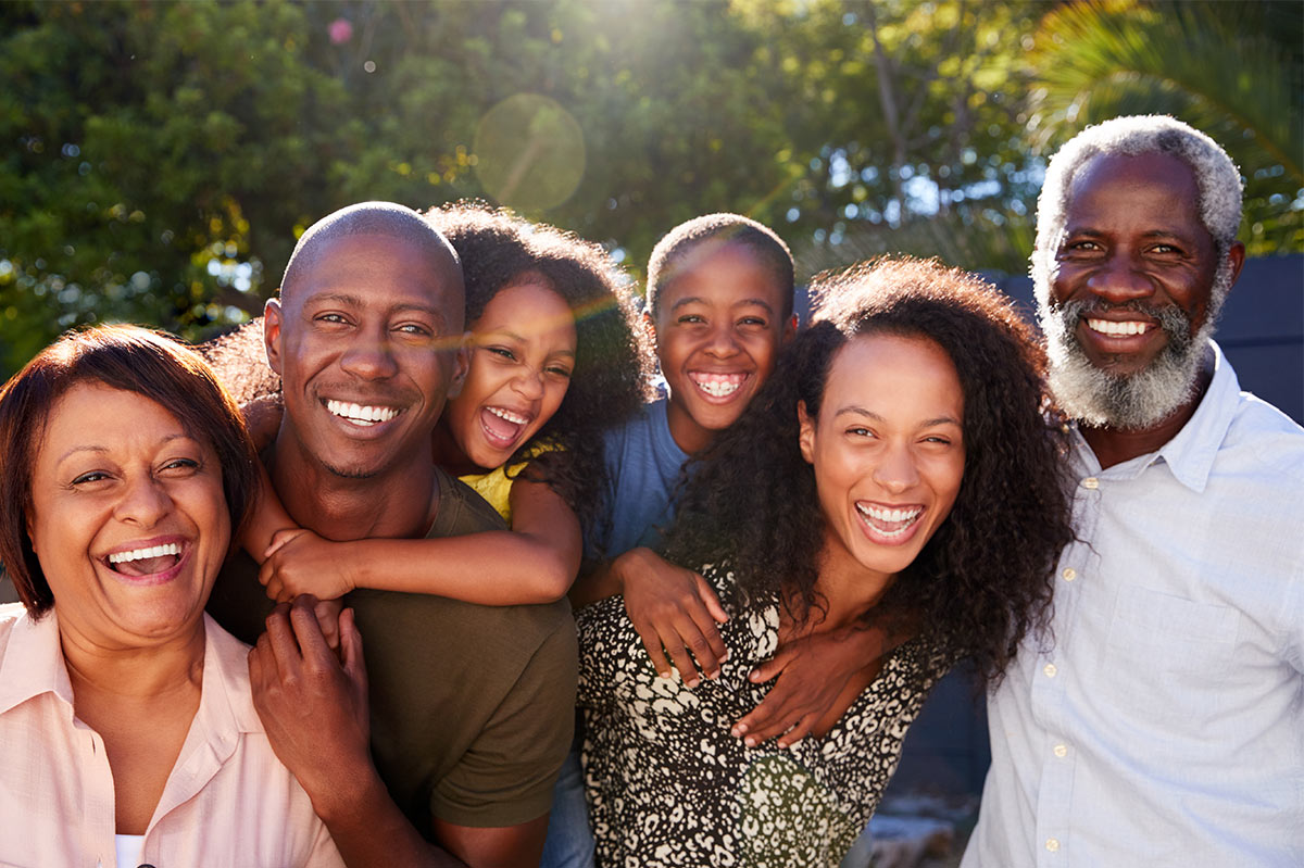 a black family, smiling and laughing