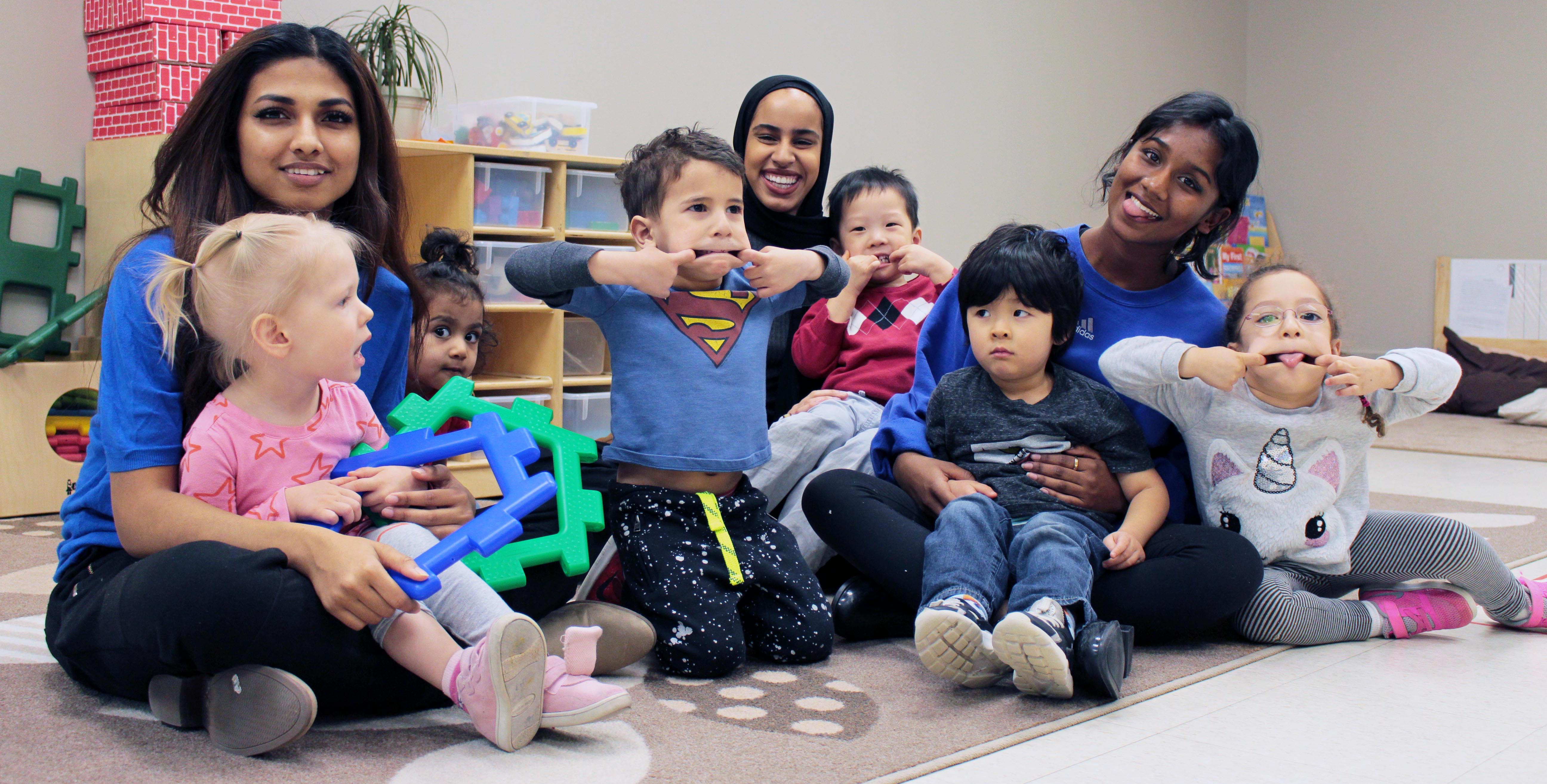 Children and educators making funny faces