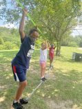 Kids balancing on a slack line