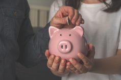 Person holding a piggybank