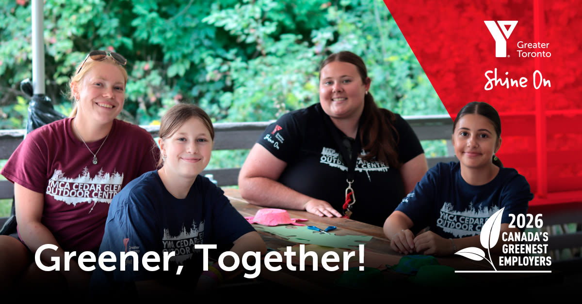 Text: Greener, Together. Photo: A group of four young adults and youth, seated together at a table. Each wears a Y M C A Cedar Glen Outdoor Centre t-shirt.
