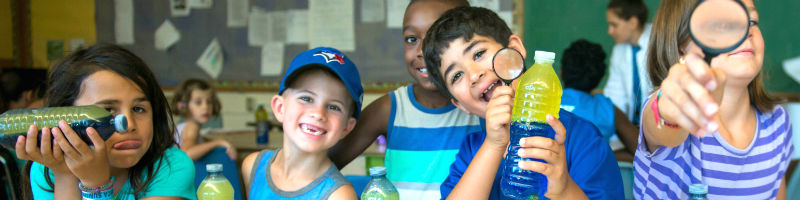Campers smiling with their do-it-yourself lava lamps.